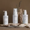 The complete cadó ritual bundle including Leave-in Conditioner, Curl Defining Foam, and the 'For Little Curls' edition on a stone display.