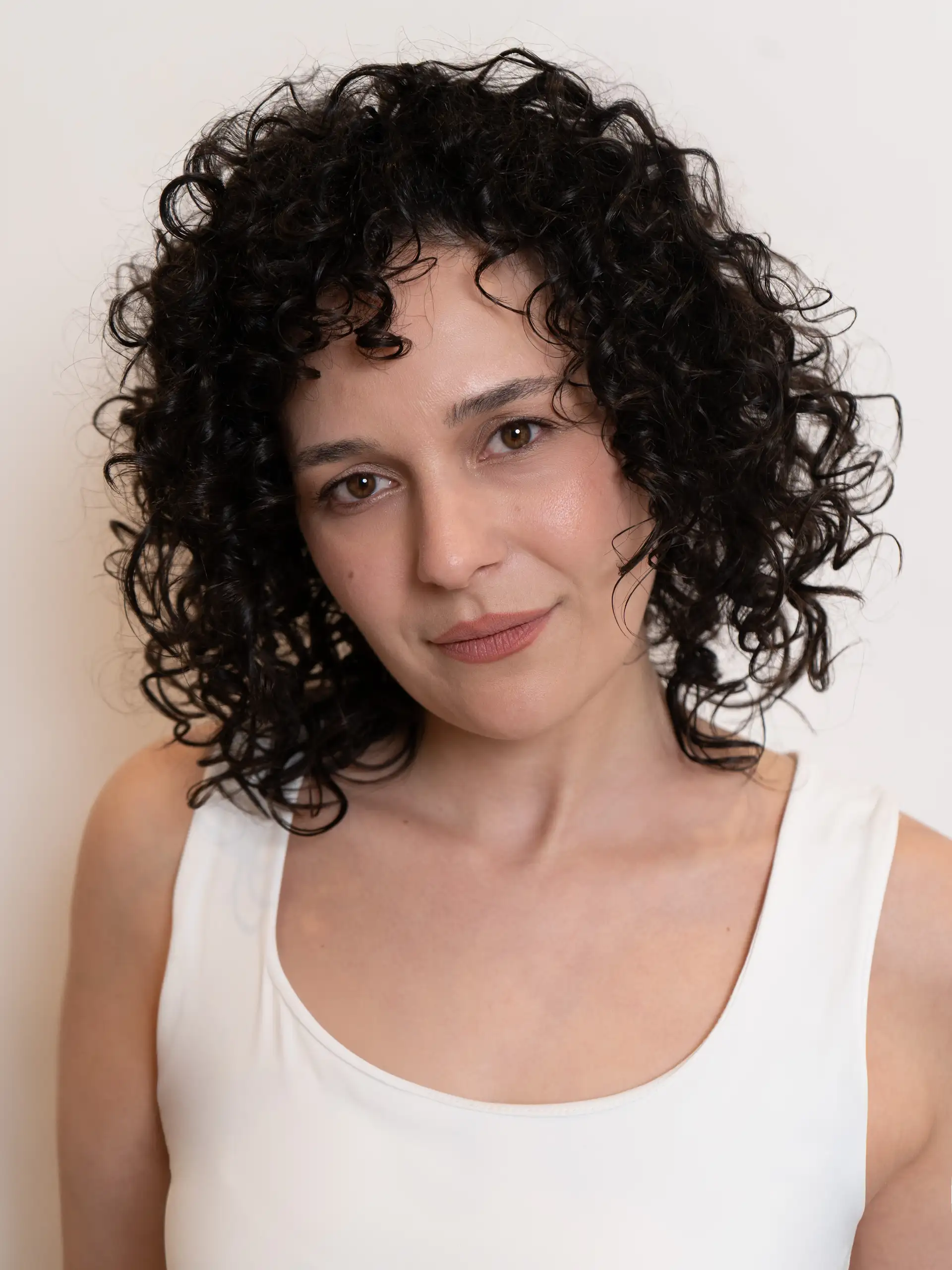Natural volume and curl definition on shorter hair using cadó styling products.